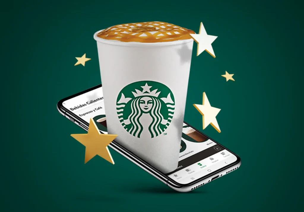 Kaffeebecher auf Smartphone: Gamification Loyalty‑Programm