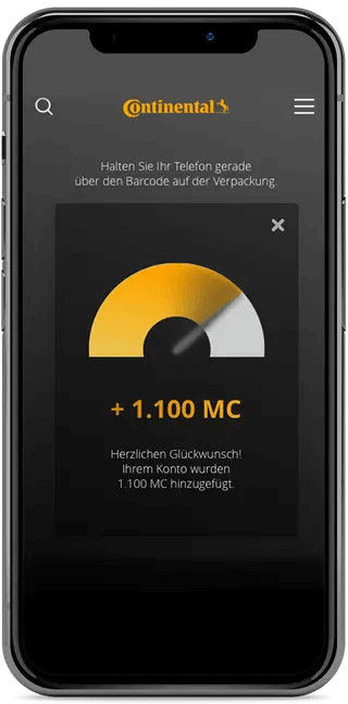 Smartphone zeigt Continental Loyalty‑Programme: 1.100 MC Gutschrift